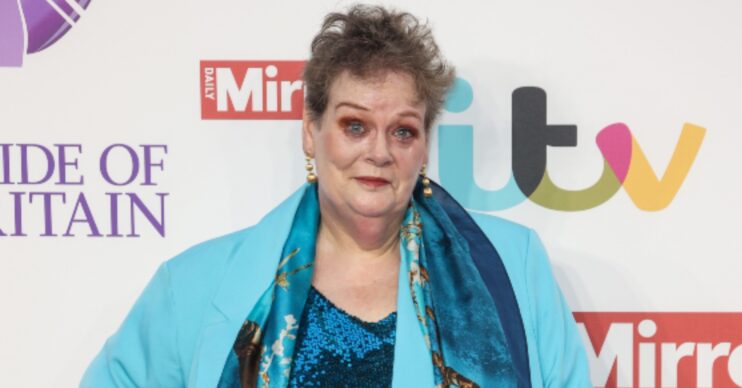 Anne Hegerty in a bright blue jacket with a dark blue scarf on