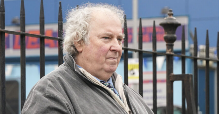 Nigel on a park bench on EastEnders, looking ponderous (Credit: BBC/Composite: ED!)