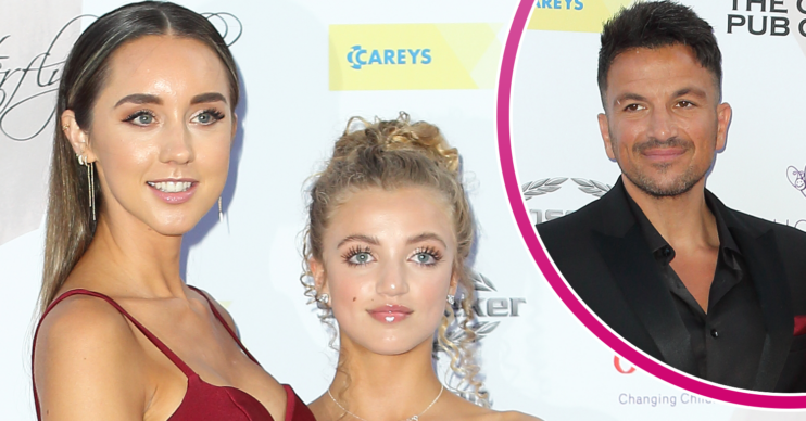 Peter Andre looking at his wife and daughter