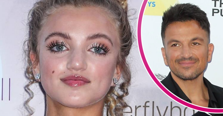 Princess Andre looks into the camera, Peter Andre looks to the side